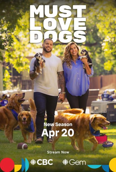 Brady Oliviera and Alex Blumberg holding puppies surrounded by dogs. CBC's Must Love Dogs